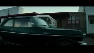 Green truck in front of Chinese building — Bruce Lee: Birth of The Dragon