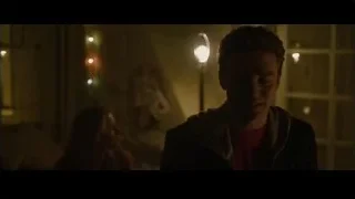 man and woman in dimly lit room with string lights — The Social Network