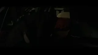 elderly man smiling in dimly lit garage — Batman