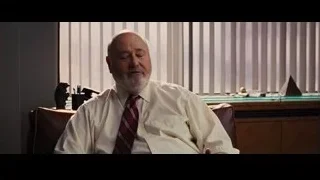 Elderly man gesturing in office chair — The Wolf Of Wall Street
