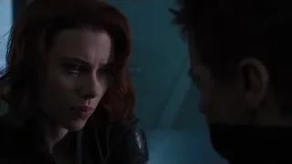 Woman and masked man in tense dark room — The Avengers
