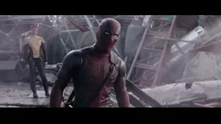 Deadpool standing in rubble with man — Deadpool