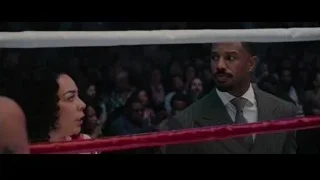 man and woman conversing in boxing ring — Creed 3