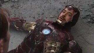 man in red and gold suit lying on ground — The Avengers
