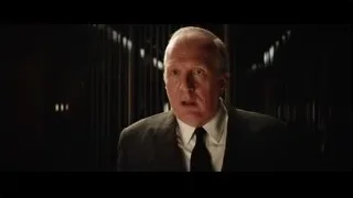 Man in dark room deep in thought — Ford v Ferrari