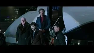 men in formal attire by private jet — Now You See Me 2