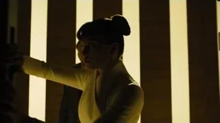 man in dimly lit room with vertical lines — Blade Runner 2049