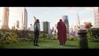 Man in red cloak leaning on pillar with woman — Doctor Strange 2