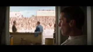 man looking at crowd in stadium — Ford v Ferrari