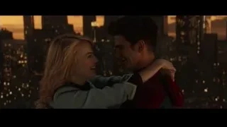 young couple embracing at city skyline — The Amazing Spider Man 2