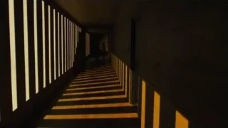 man and woman in dimly lit hallway — Blade Runner 2049