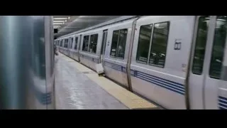 man walking through subway station — The Persuit of Happyness