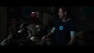 man looking at Iron Man suits — Iron Man 3