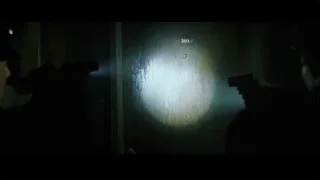 person holding gun in dark room — The Matrix