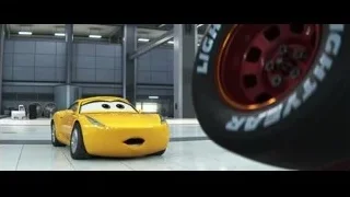 yellow sports car in large warehouse — Cars 3