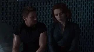 Man and woman sitting in dark room — The Avengers
