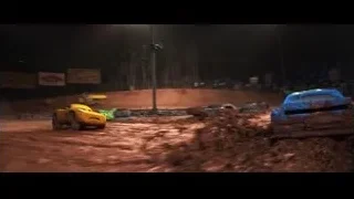yellow sports car racing on dirt track at night — Cars 3
