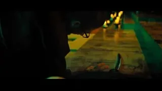 Man kneeling with lit candles — John Wick: Chapter 4