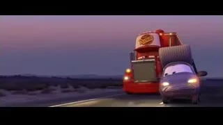 Large red truck driving on highway at dusk — Cars