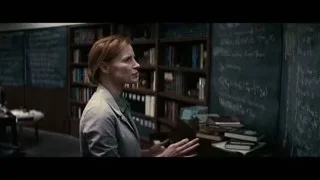 Woman explaining at blackboard in library — Interstellar
