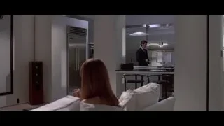 Man and woman talking in modern kitchen — American Psycho