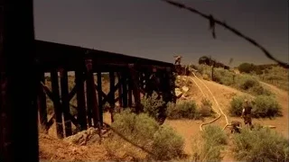 People walking on old wooden bridge in desert — Breaking Bad