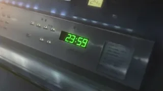 digital clock displaying 23:59 — Weathering with You