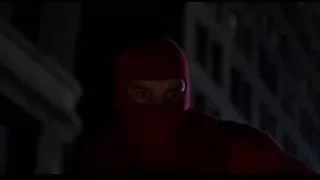 busy street with cars driving at night — Spider Man