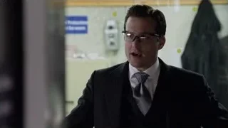 man in suit standing in hallway — Suits