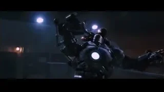 person's hand holding a gun — Iron Man