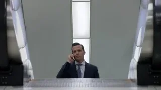 Men in suits walking in hallway — Suits