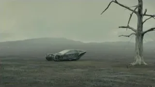 bird flying over barren landscape with car — Blade Runner 2049
