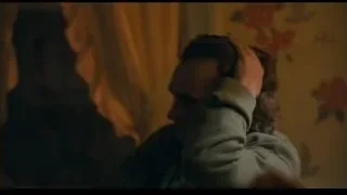 woman sitting on bed with baby — Joker