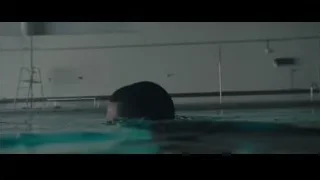 man swimming in pool — Creed 2