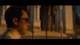 man in sunglasses in front of columns — John Wick: Chapter 4