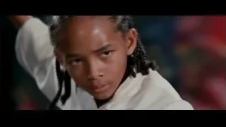 young person with braided hair looking seriously — The Karate Kid