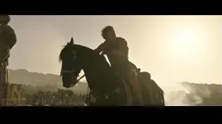 Man on black horse galloping in battle — Gladiator 2