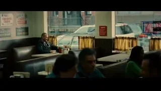 man sitting at restaurant table — Limitless