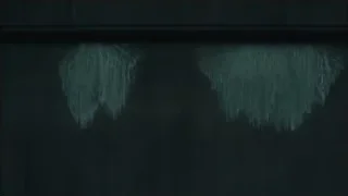 waterfall cascading down dark misty wall — Blade Runner 2049