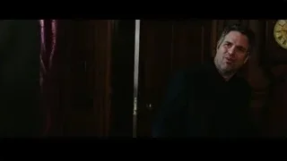 man in dark suit in room with clock — Now You See Me 2