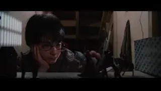 boy with glasses at desk deep in thought — Harry Potter and the Philosophers Stone