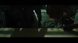 Man in suit walking down dark staircase — John Wick: Chapter 4