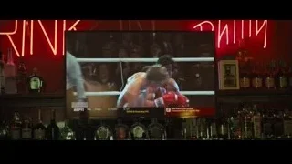 two men boxing on bar screen — Creed 2