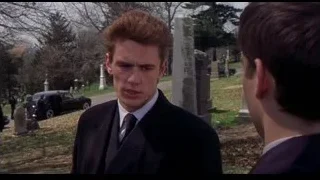 young man in suit standing in cemetery — Spider Man