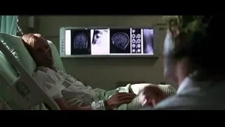 woman in hospital bed with screen — Batman: The Dark Knight