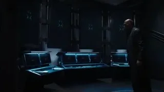 man in control room with multiple screens — The Avengers