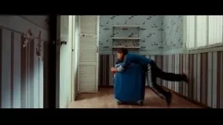 person with blue suitcase in room — The Karate Kid