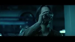 man with beard in dimly lit room — John Wick