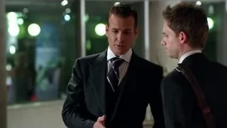 three men in suits talking in lobby — Suits