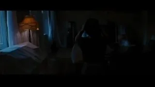 woman in dimly lit bedroom — Batman: The Dark Knight Rises